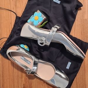 Prada 39.5 Silver 2.5 inch heel pumps.  Shoes are brand new.  No box, only bags.